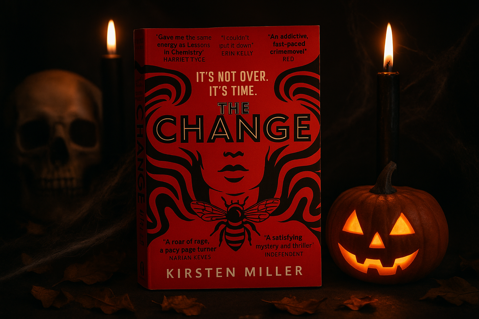 Book titled 'The Change' by Kirsten Miller with Halloween-themed elements like candles and a pumpkin.